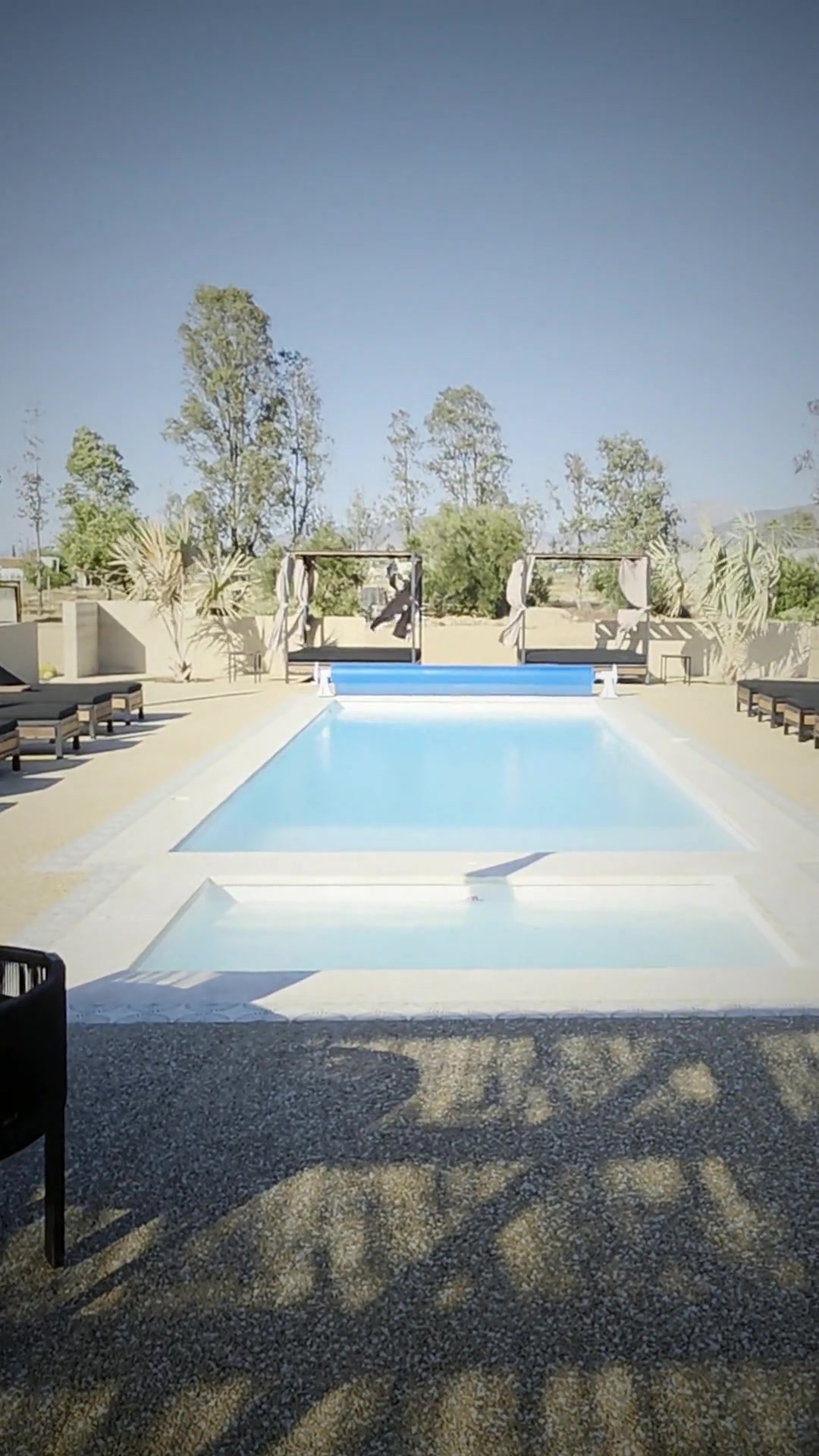 The pool and loungers over the valley