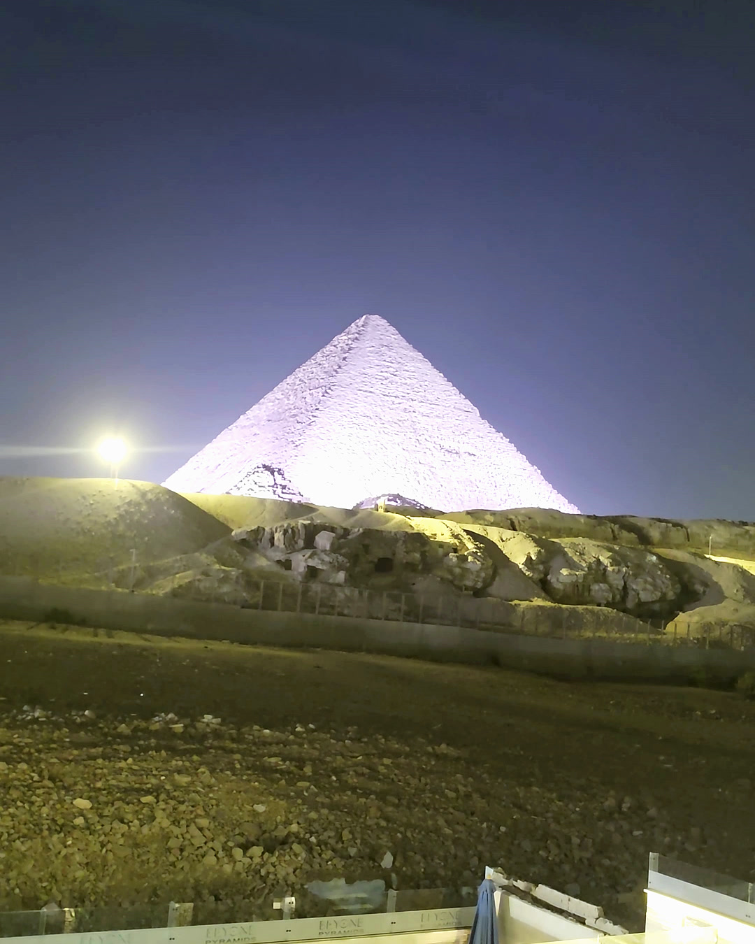 The Great Pyramid lit at night from the rooftop